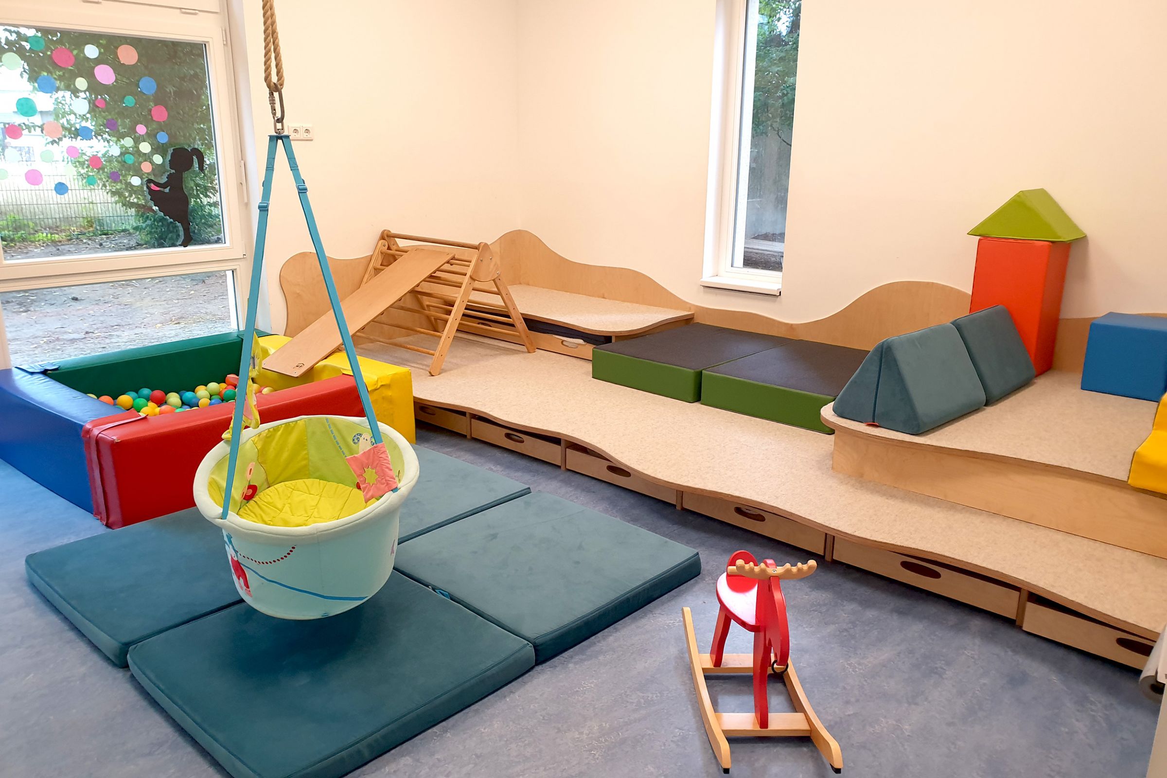 Ev. Kita Rupelrath - Nestbereich und Schlafraum Ein Spielbereich der Ev. Kita Rupelrath.